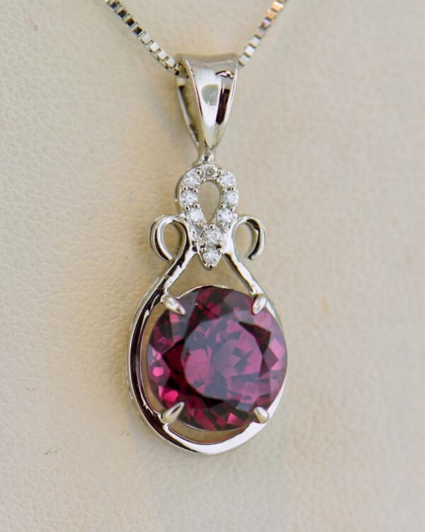 raspberry red rhodolite garnet and diamond pendant