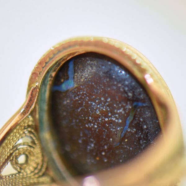 vintage ring with boulder opal bezel set with rope accents 3
