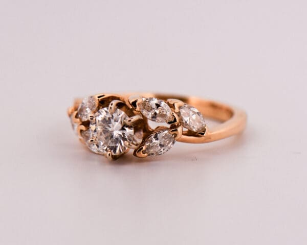 yellow gold engagment ring with round diamond and marquise diamond accents 3