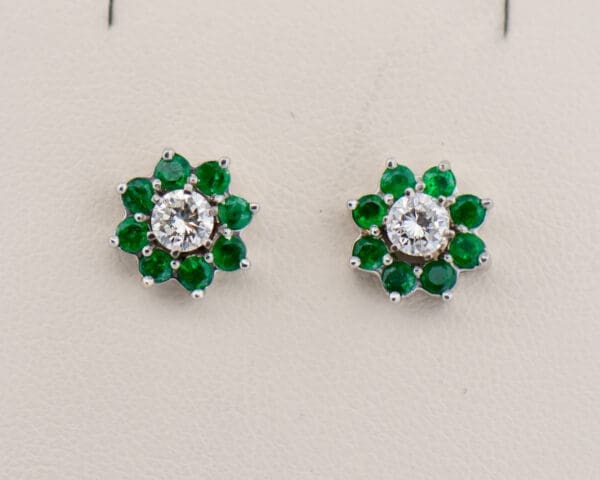 diamond stud earrings with emerald halo jackets