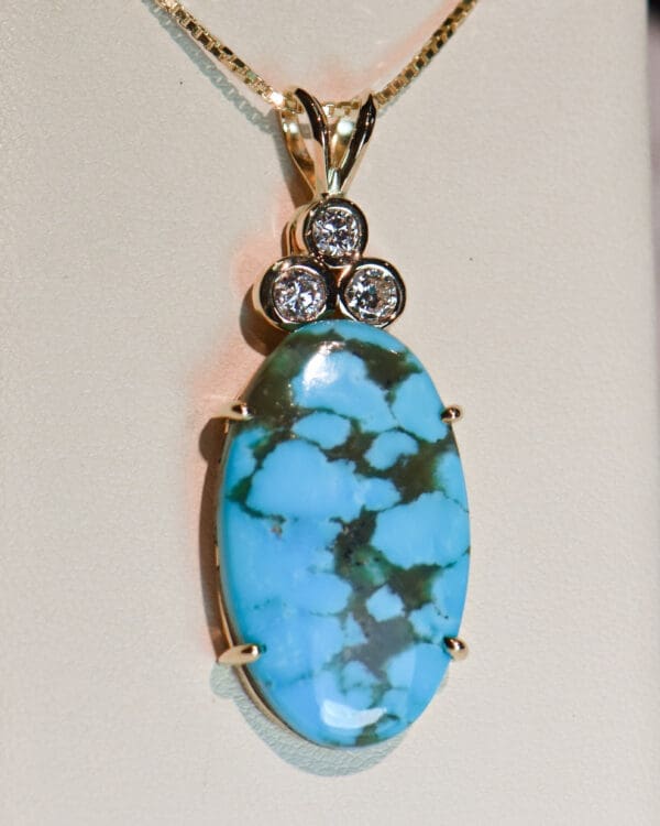 large kingman turquoise and diamond pendant set in yellow gold 4