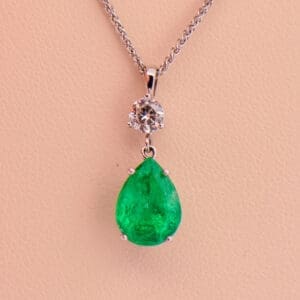 natural pear shape emerald and diamond drop pendant