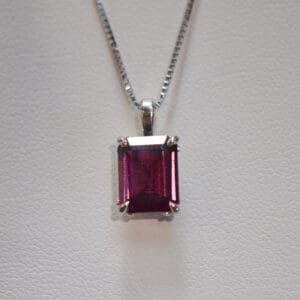 emerald cut raspberry rhodolite garnet solitaire pendant