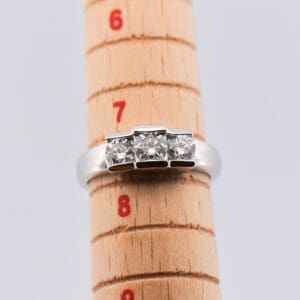 estate three stone low profile white gold diamond ring