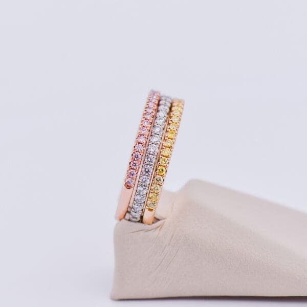 fancy pink diamond yellow diamond and white diamond stacking wedding bands 3