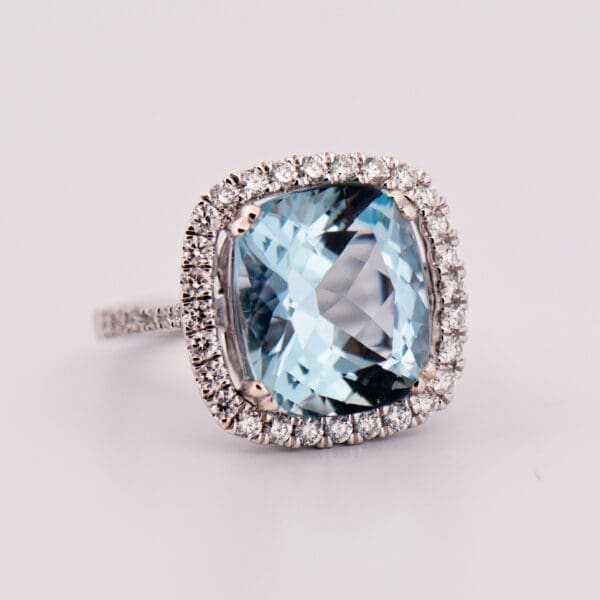 large cushion cut aquamarine and diamond halo cocktail ring