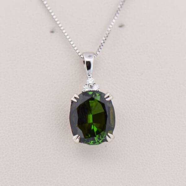 large dichroic deep green tourmaline and diamond pendant 4