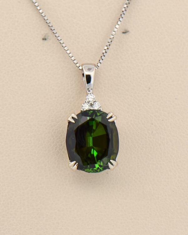 large dichroic deep green tourmaline and diamond pendant