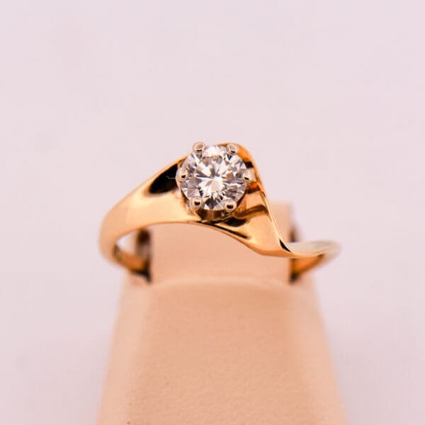 mid century curved gold engagement ring with half carat diamond 4