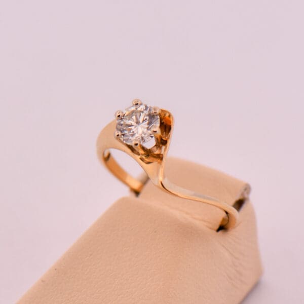 mid century curved gold engagement ring with half carat diamond 5