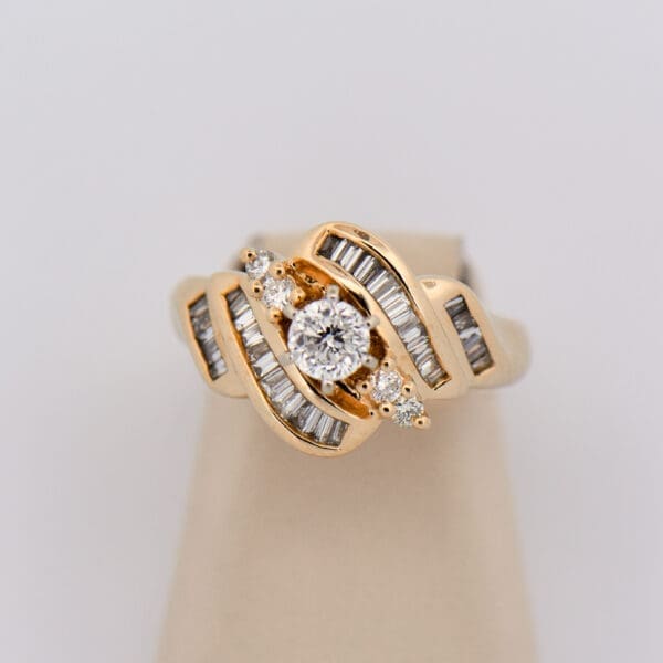 modern estate yellow gold diamond ring with channel set accents