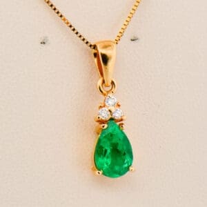 pear shape colombian emerald and diamond pendant