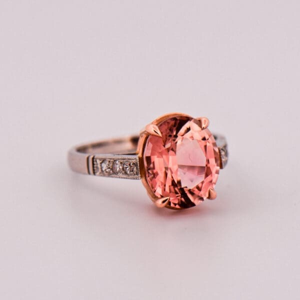 platinum ring set with rare pink peach tourmaline and diamonds