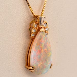 top gem pear shape australian opal and diamond pendant
