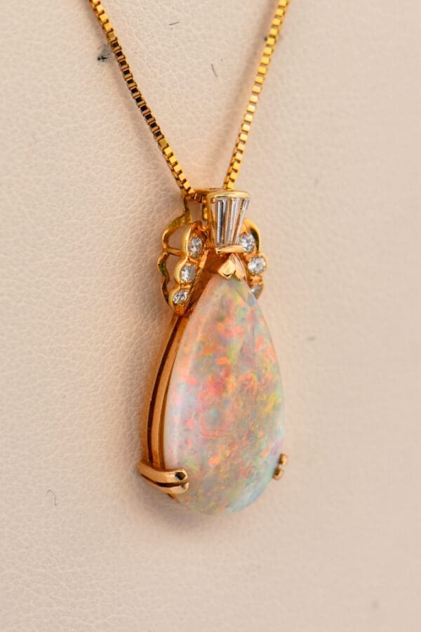 top gem pear shape australian opal and diamond pendant