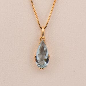 antique gold pendant with pear shape aquamarine