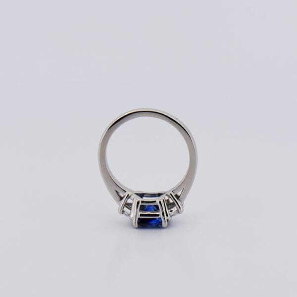 asscher cut blue sapphire and half moon diamond three stone ring 3