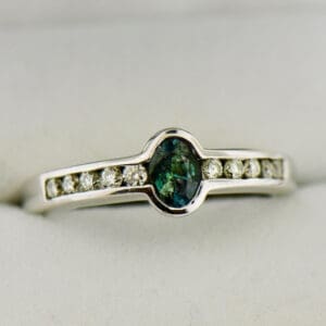 bezel set natural alexandrite and diamond ring