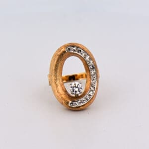 mid century modern open space cocktail ring with textured gold and diamonds