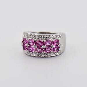 modern wide band ring with two rows of pink sapphires