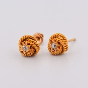victorian gold love knot stud earrings with diamond accents