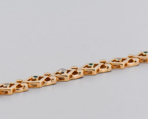 vintage yellow gold geometric link bracelet with emeralds and diamonds 2