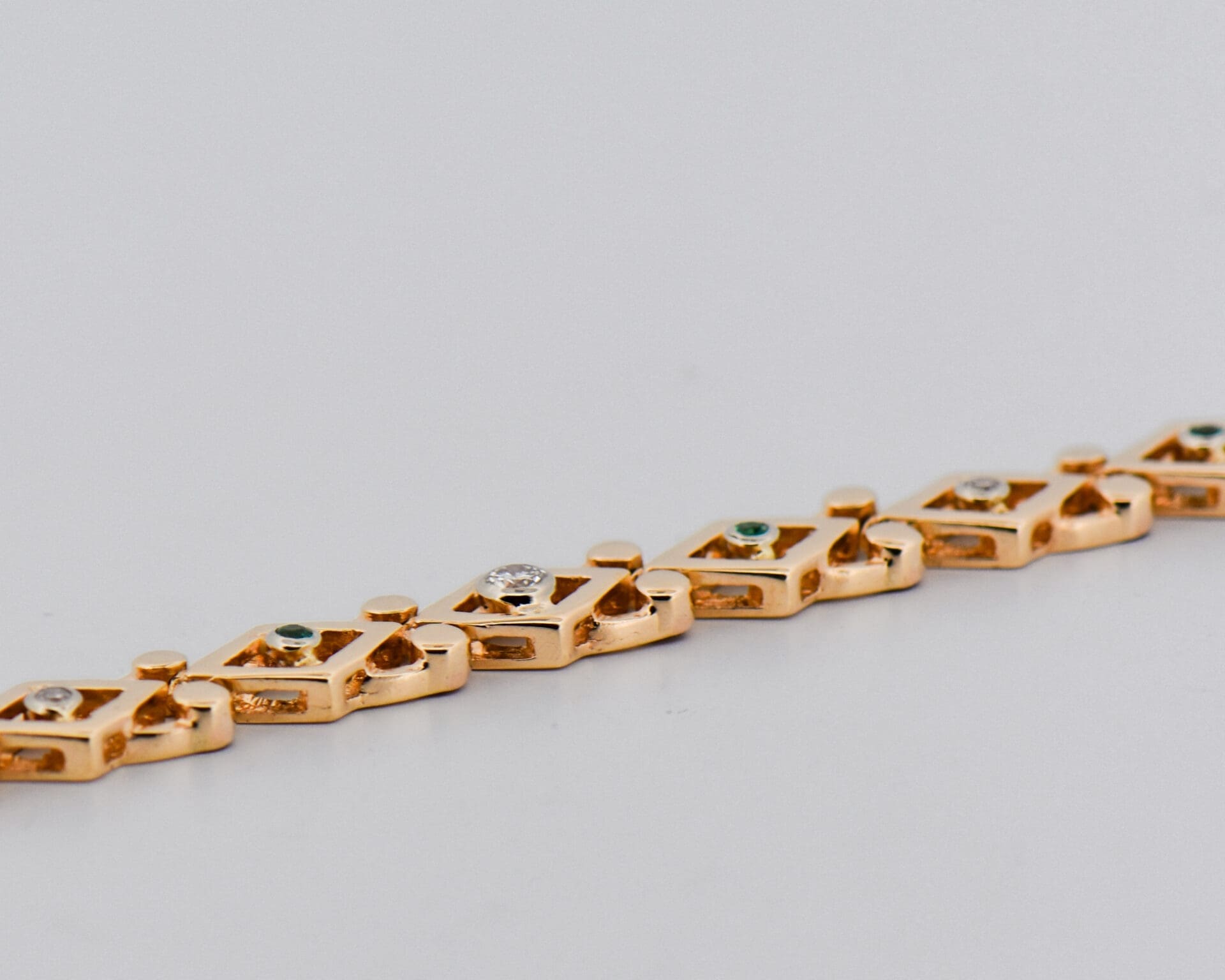 vintage yellow gold geometric link bracelet with emeralds and diamonds 2