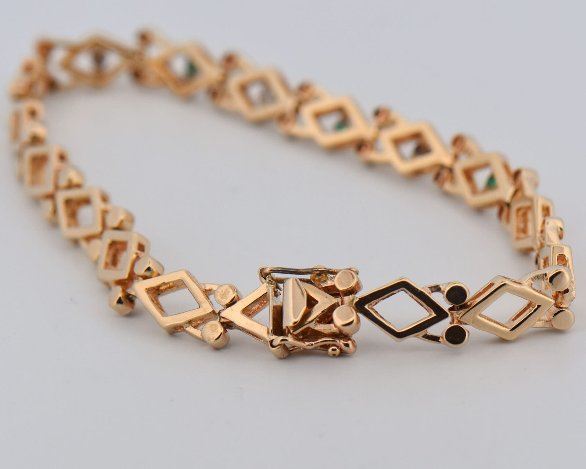 vintage yellow gold geometric link bracelet with emeralds and diamonds 5